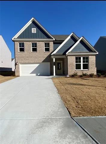 a front view of a house with yard