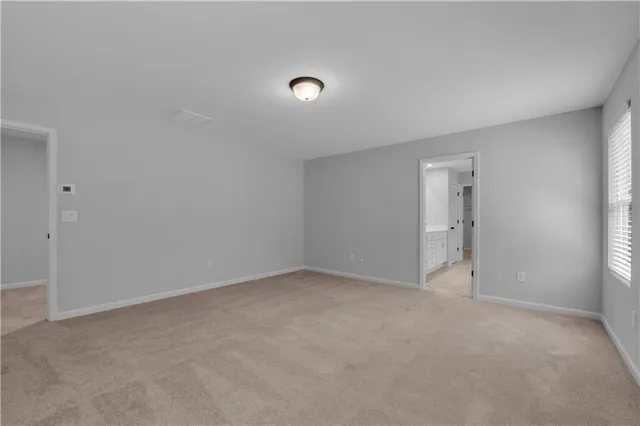 a view of an empty room and entryway