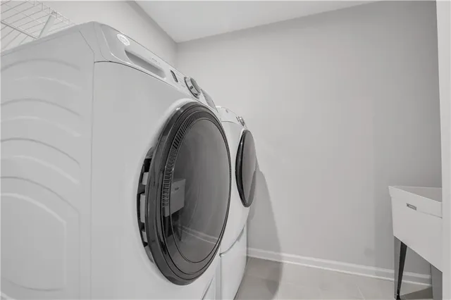 with utility room with dryer and washer