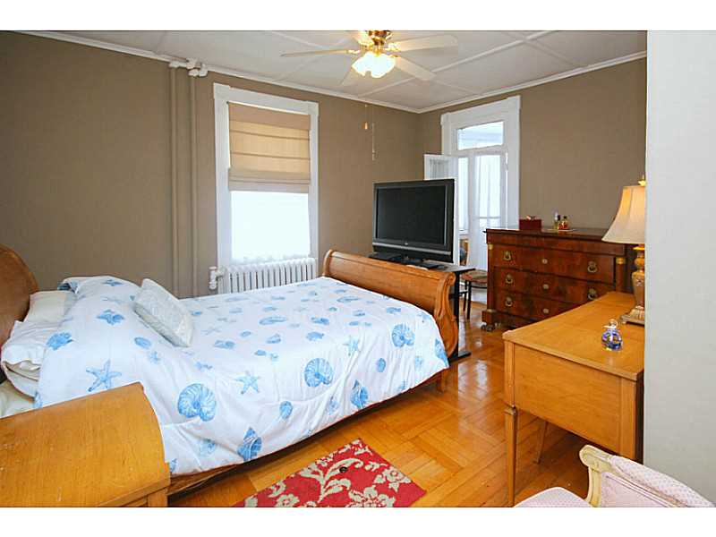 216 Spring Street Newport, RI 02840 - Photo 11 of 25 Master Bedroom. This Master Bedroom is 14 x 16 and has a porch/turret for reading and relaxing.