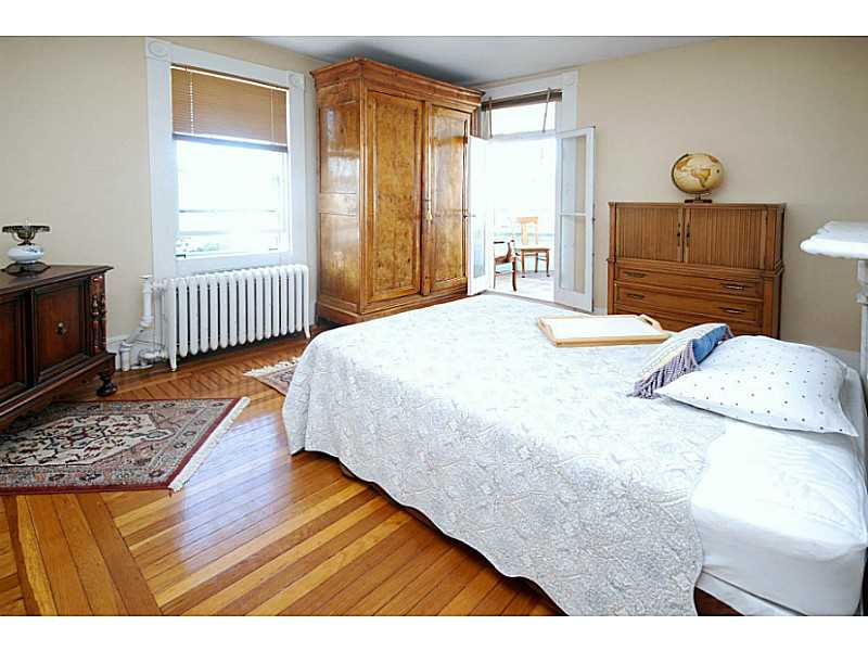 216 Spring Street Newport, RI 02840 - Photo 18 of 25 Bedroom. This 2nd floor Bedroom is 14 x 15 and leads to the porch/turret.