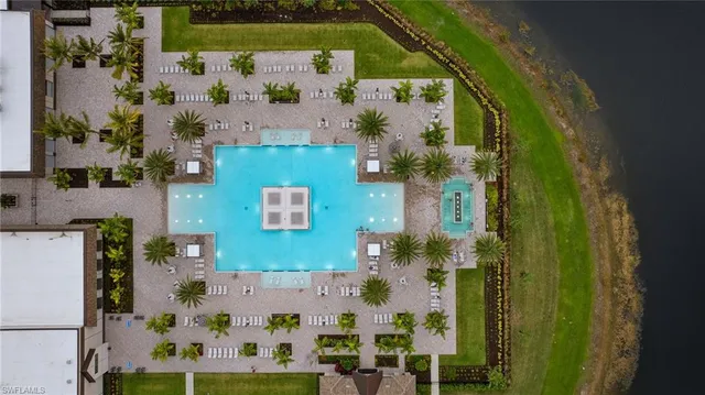an aerial view of a house with a lake view
