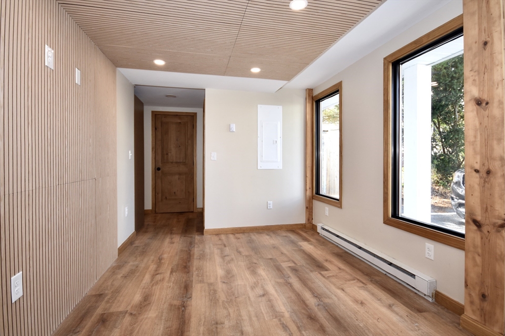 130 Swindells Street, Unit 2 Fall River, MA 02723 - Photo 3 of 7 a view of hallway with windows and wooden floor