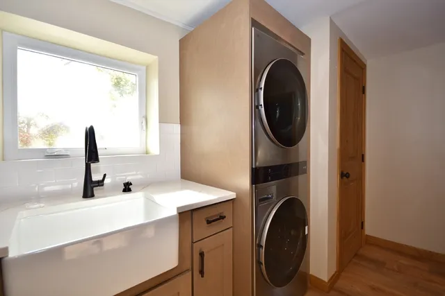 a bathroom with a sink and a washing machine