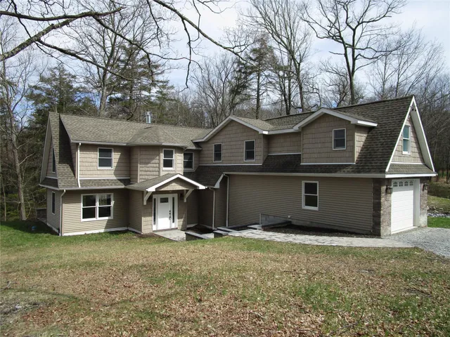 front view of a house with a yard