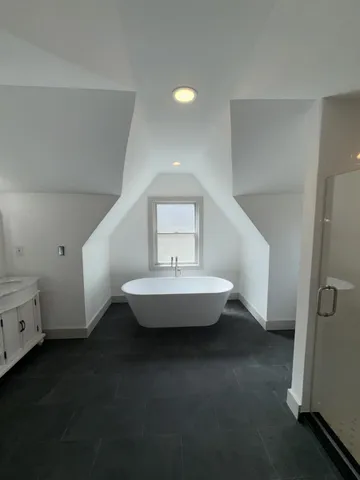 a bathroom with a double vanity sink and mirror