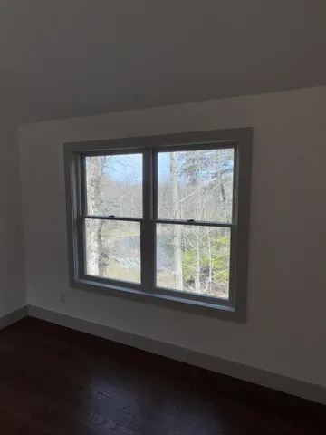 a view of a room that has a window in it