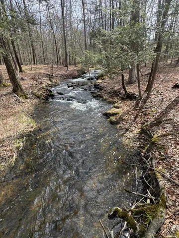 a kitchen with a refrigerator a stove top oven and a counter top space