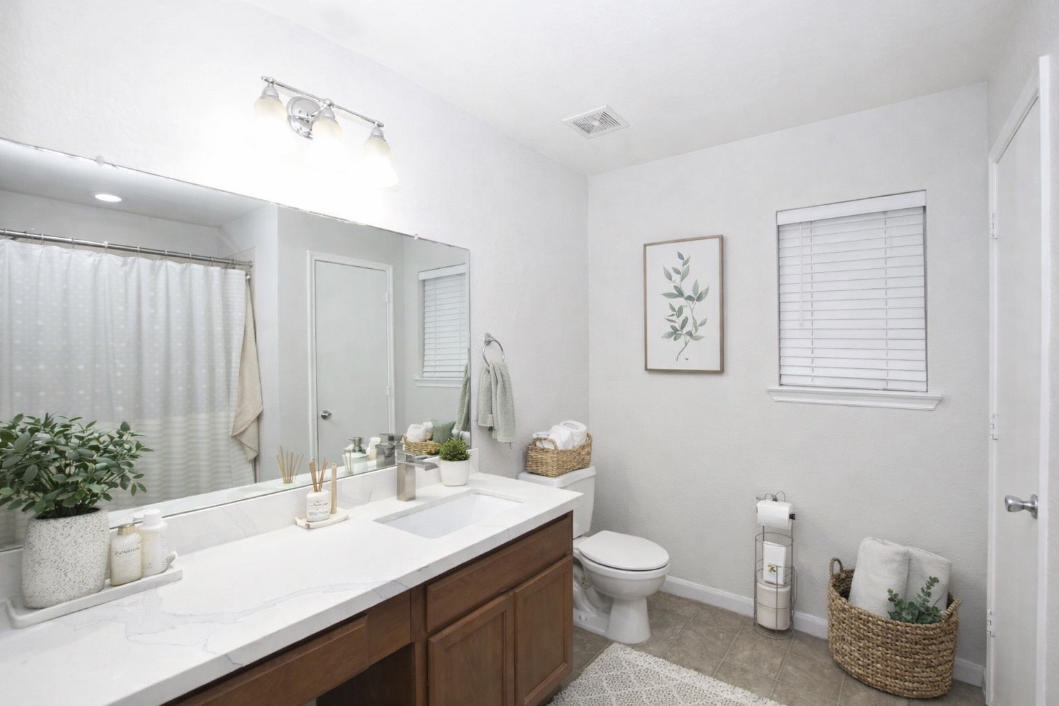910 Staffordale Manor Lane Houston, TX 77047 - Photo 5 of 6 a bathroom with a granite countertop sink a toilet and a mirror