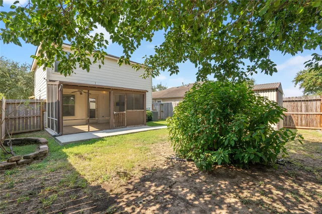 a view of a house with backyard porch and sitting area