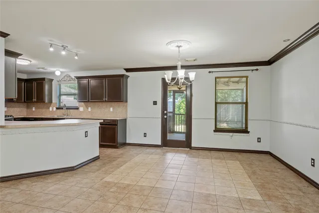 a kitchen with stainless steel appliances granite countertop a sink and stove top oven