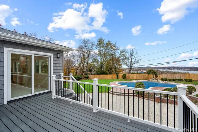 a view of a balcony with wooden floor