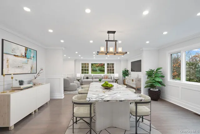 a view of a dining room with furniture window and outside view