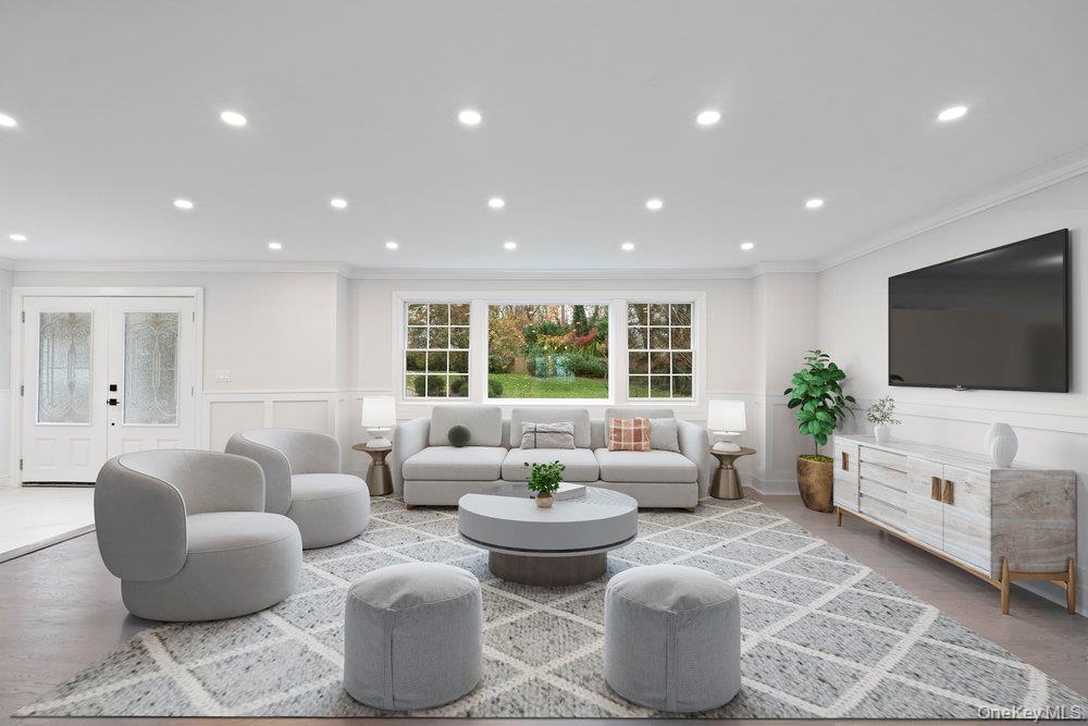 52 Woodland Road Roslyn, NY 11576 - Photo 19 of 23 a living room with furniture and a flat screen tv