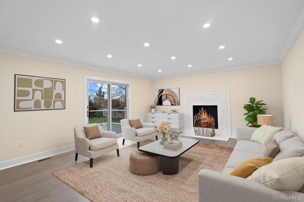 52 Woodland Road Roslyn, NY 11576 - Photo 20 of 23 a living room with furniture and a large window