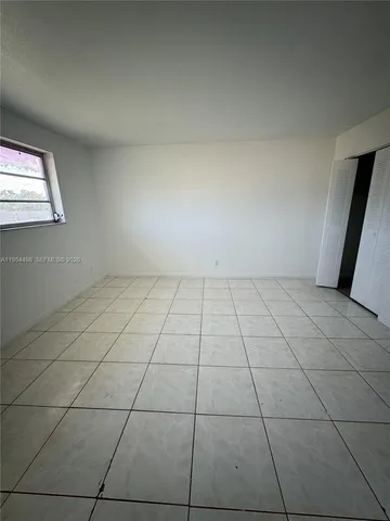 an empty room with white walls
