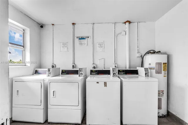 a view of a kitchen with refrigerator and washer