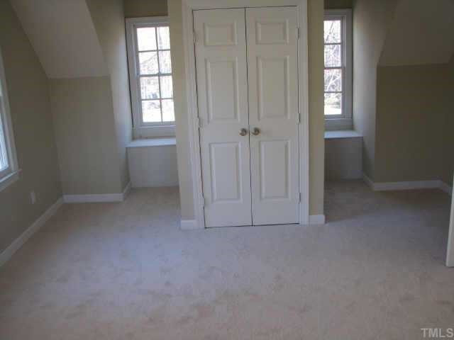 2417 Basil Drive Raleigh, NC 27612 - Photo 7 of 12 Bedroom over the garage is huge and is great for a 4th bedroom or a playroom. Other