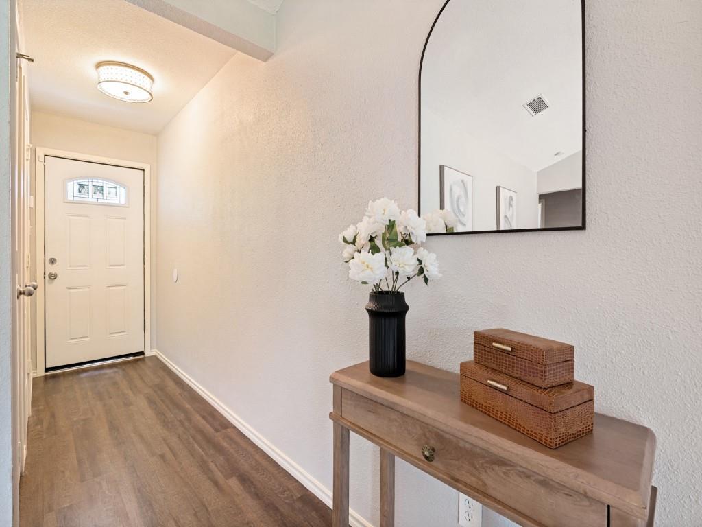 1405 Rambler Road Arlington, TX 76014 - Photo 5 of 26 Entryway with wood-finish flooring, a white paneled door with decorative glass, and a flush-mount ceiling light