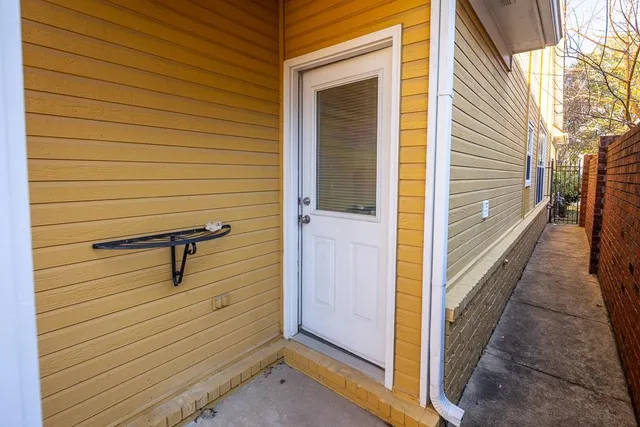 a view of a door and a window