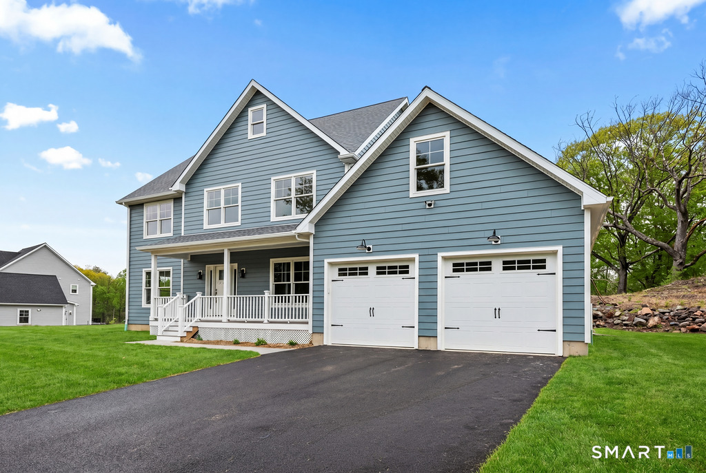 8 Ridgewood Club Road Prospect, CT 06712 - Photo 3 of 40 a front view of a house with a yard and garage