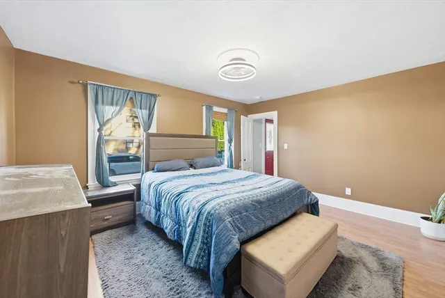 a bedroom with a large bed and a couch