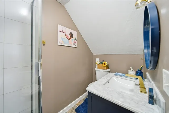 a bathroom with a sink vanity and a mirror