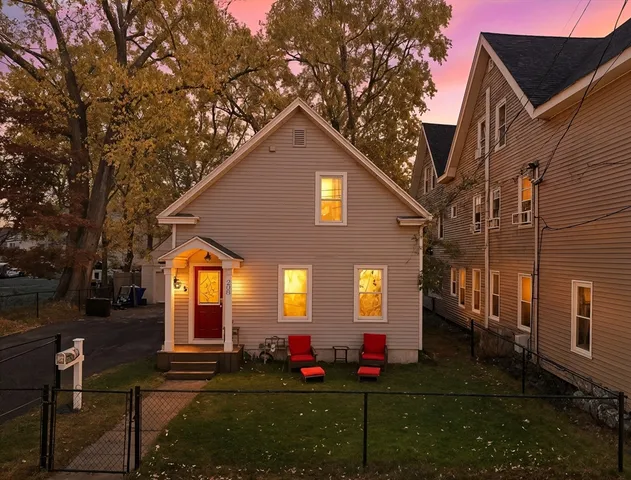 a front view of a house with a yard