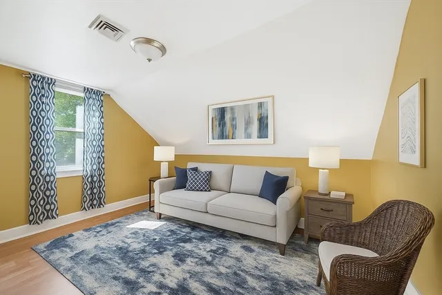 a living room with furniture and a rug