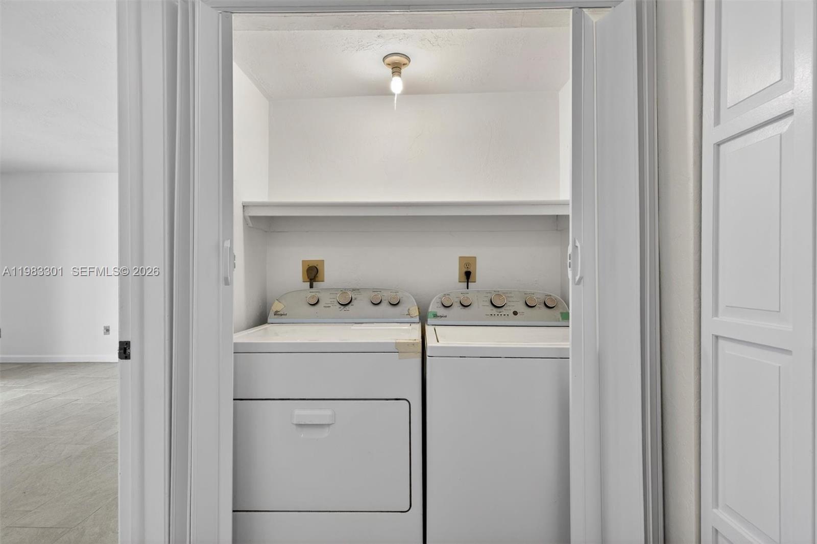 6190 Southwest 90th Court, Unit 1K Miami, FL 33173 - Photo 21 of 49 a utility room with dryer and washer