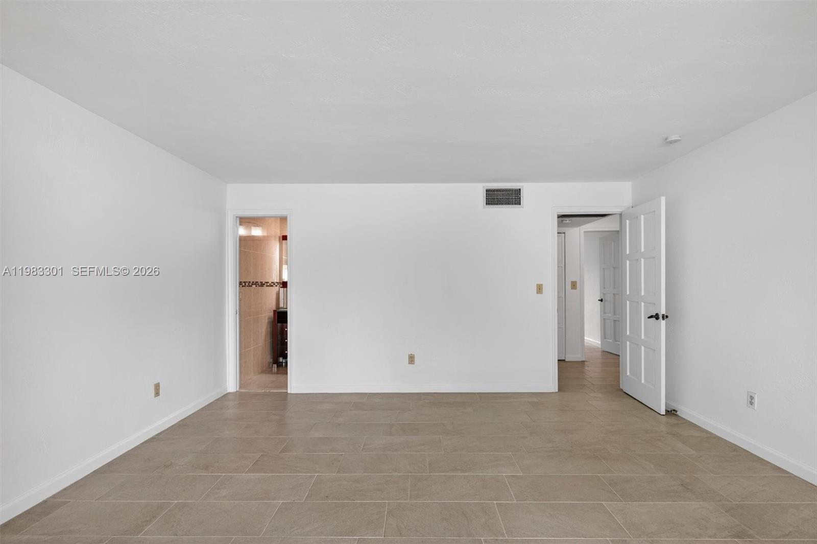 6190 Southwest 90th Court, Unit 1K Miami, FL 33173 - Photo 23 of 49 a view of an empty room