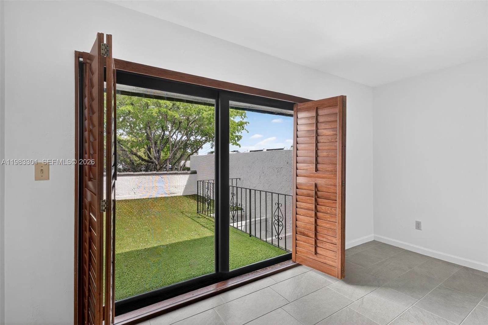 6190 Southwest 90th Court, Unit 1K Miami, FL 33173 - Photo 26 of 49 a view of a room that has a large window