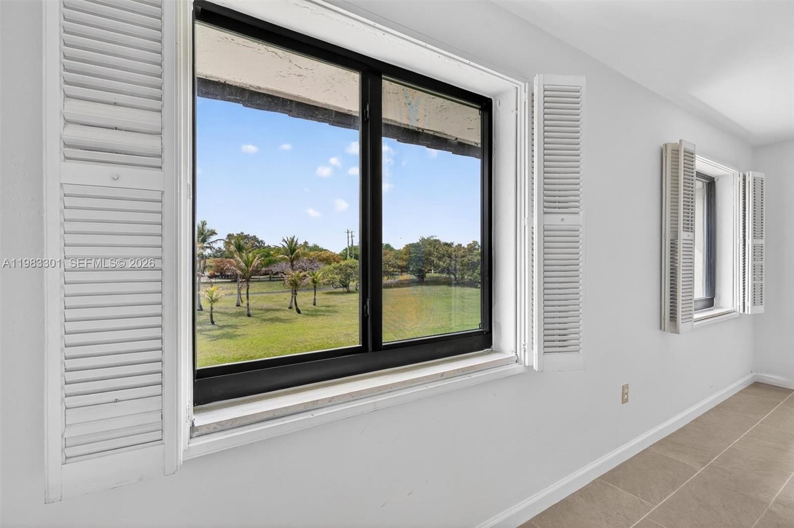 6190 Southwest 90th Court, Unit 1K Miami, FL 33173 - Photo 33 of 49 a view of a room that has a large window