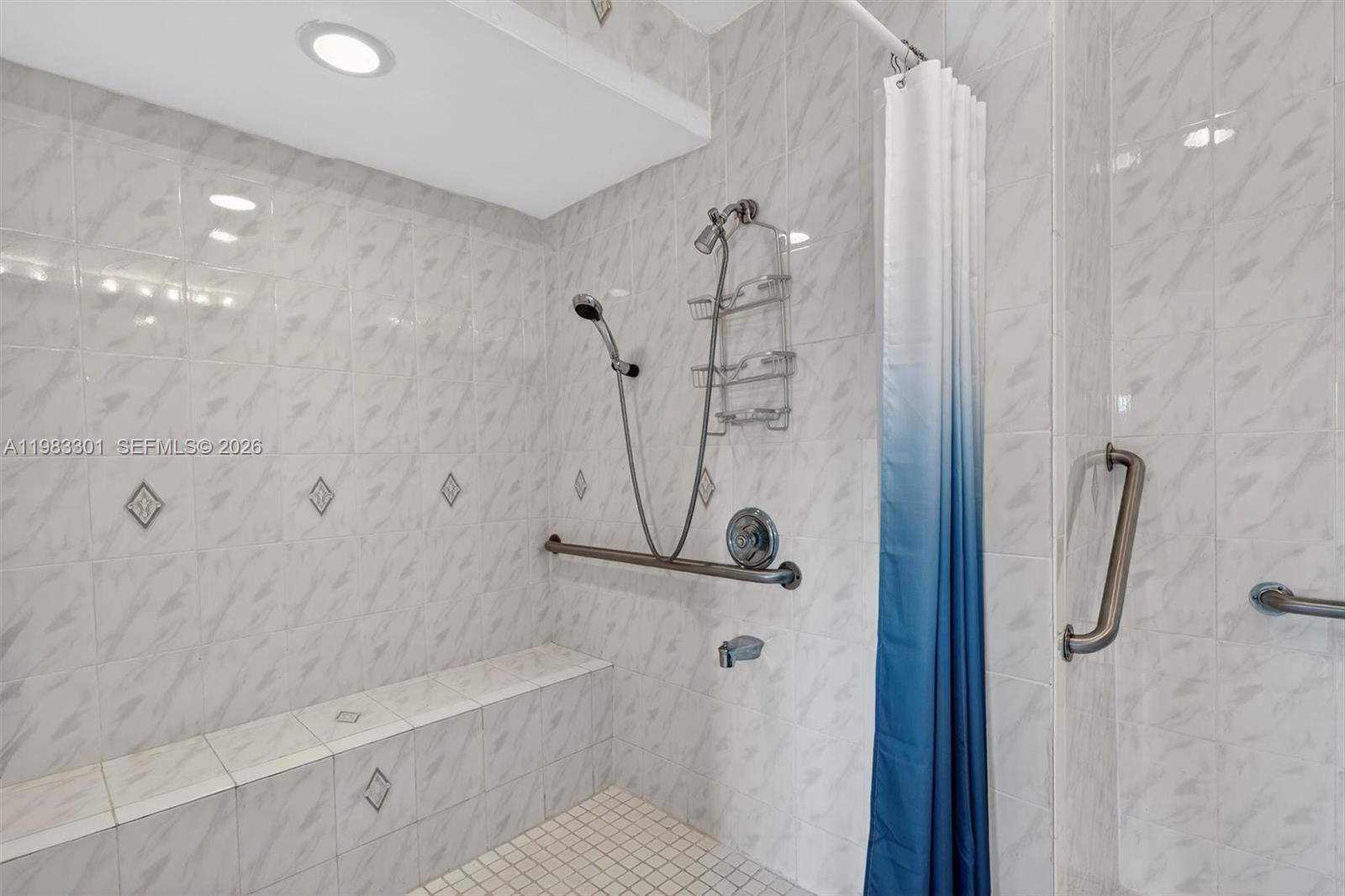 6190 Southwest 90th Court, Unit 1K Miami, FL 33173 - Photo 34 of 49 a bathroom with a shower