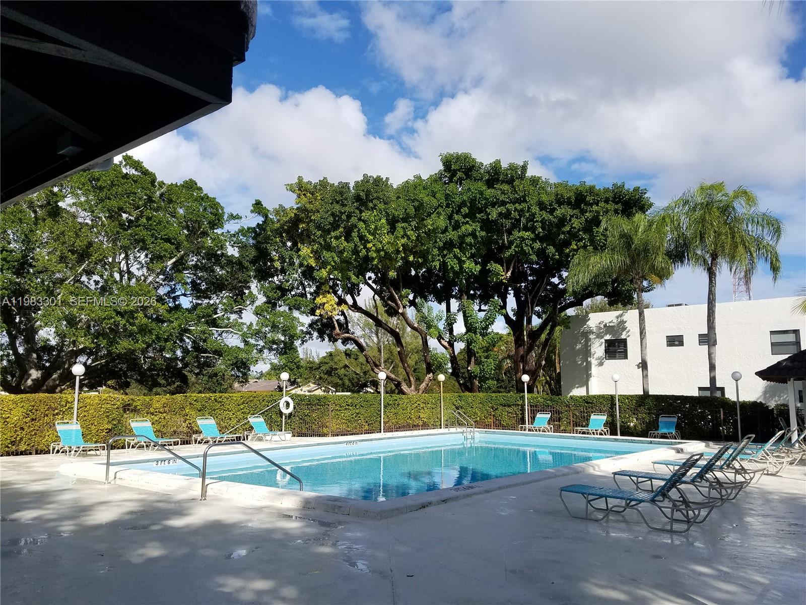 6190 Southwest 90th Court, Unit 1K Miami, FL 33173 - Photo 44 of 49 a view of a park with large trees