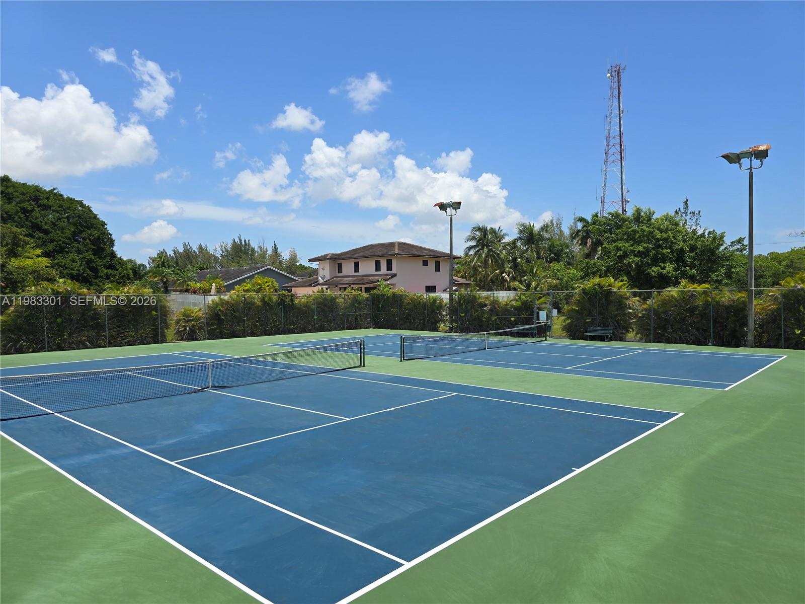 6190 Southwest 90th Court, Unit 1K Miami, FL 33173 - Photo 46 of 49 a view of an outdoor space and tennis court