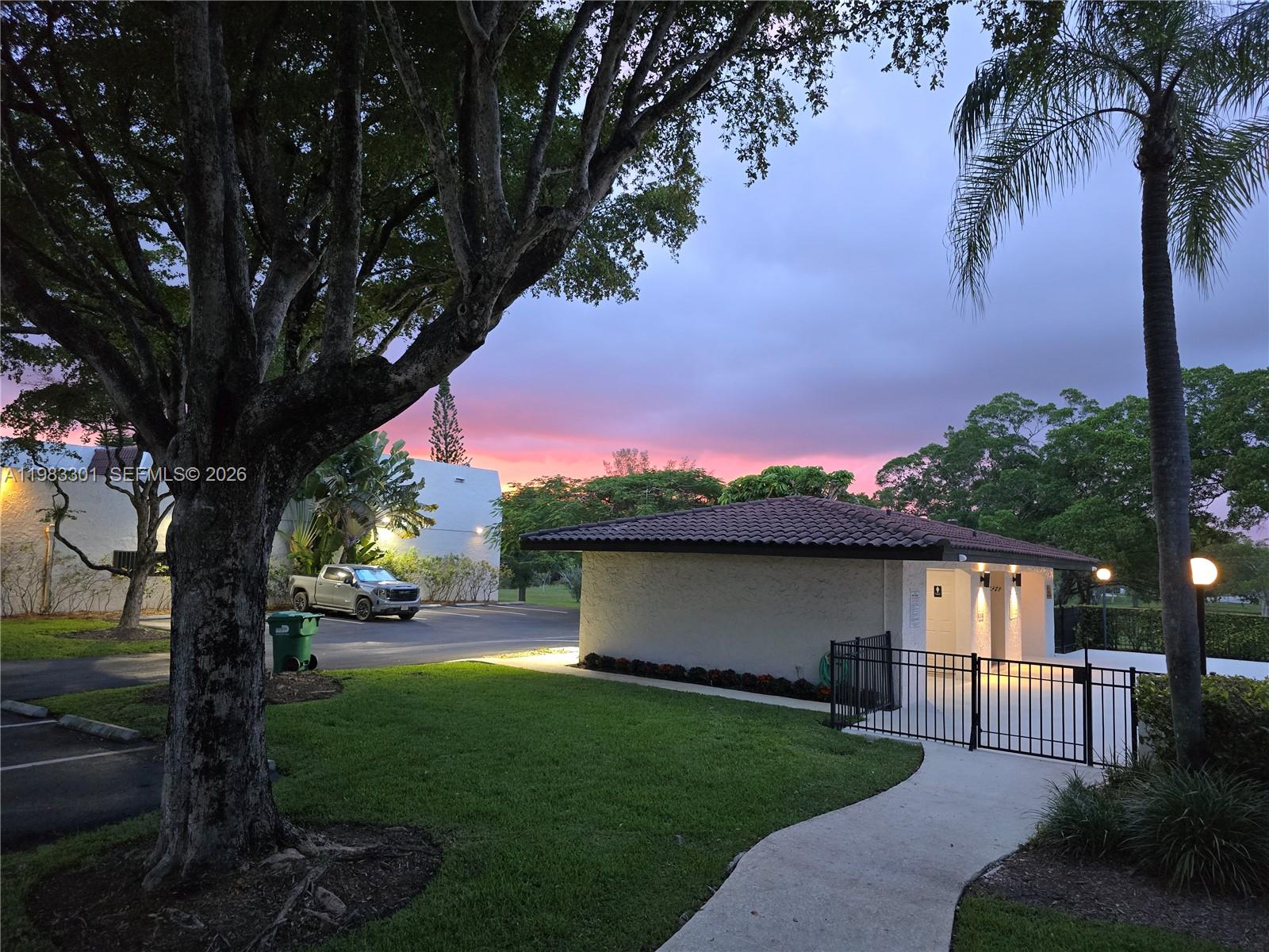 6190 Southwest 90th Court, Unit 1K Miami, FL 33173 - Photo 49 of 49 a view of a backyard with a garden