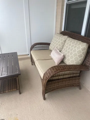 a view of a terrace with furniture and stove