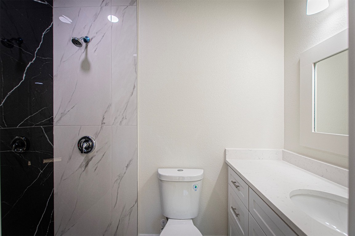 106 Passion Vine Rd Dale Dale, TX 78616 - Photo 13 of 23 a bathroom with a sink a toilet and shower