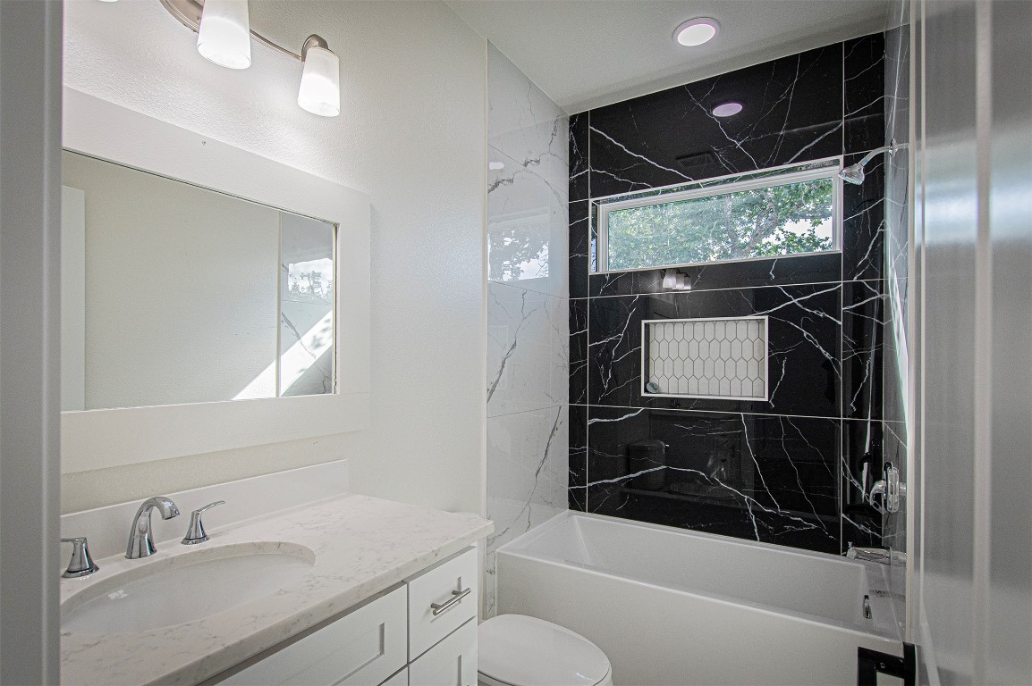 106 Passion Vine Rd Dale Dale, TX 78616 - Photo 16 of 23 a bathroom with a shower sink and mirror