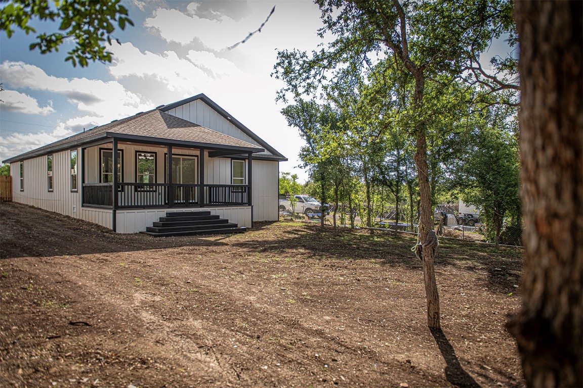 106 Passion Vine Rd Dale Dale, TX 78616 - Photo 20 of 23 a front view of a house with a yard