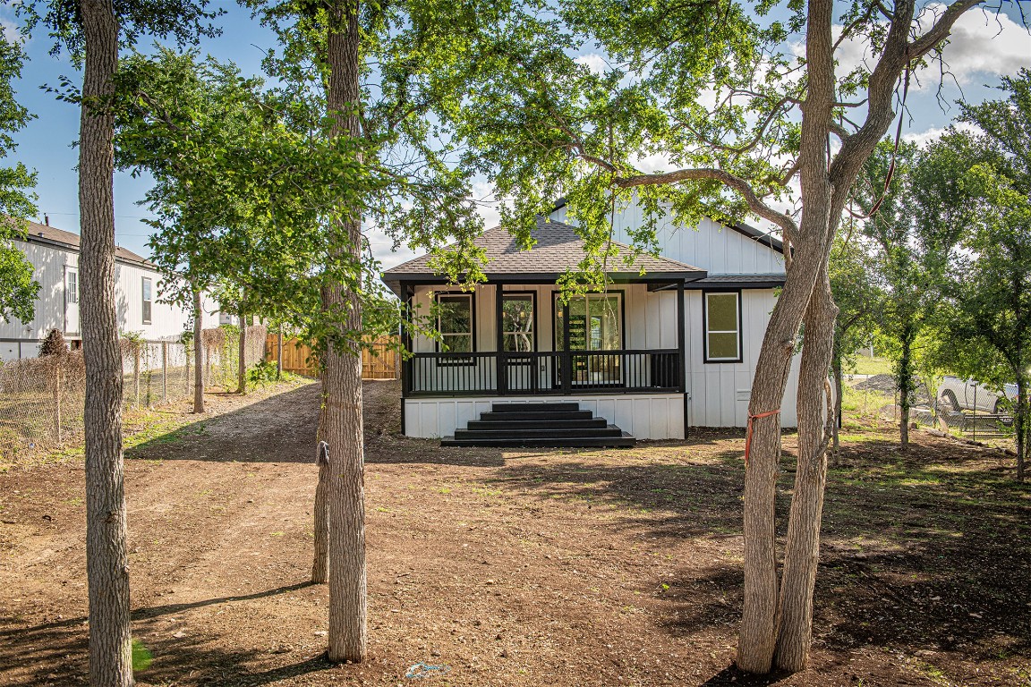106 Passion Vine Rd Dale Dale, TX 78616 - Photo 21 of 23 a view of a house with large tree in front of it