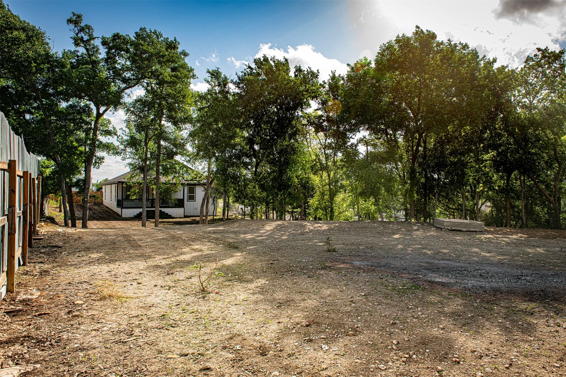 106 Passion Vine Rd Dale Dale, TX 78616 - Photo 22 of 23 a view of a yard with a tree