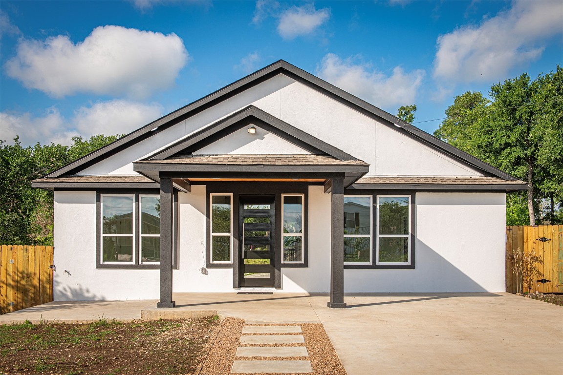 106 Passion Vine Rd Dale Dale, TX 78616 - Photo 2 of 23 a front view of a house with a yard and potted plants