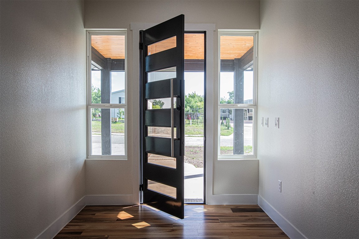106 Passion Vine Rd Dale Dale, TX 78616 - Photo 3 of 23 a view of empty room with wooden floor and fan