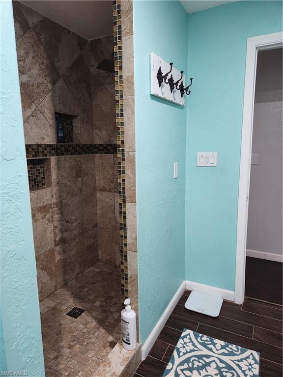 5214 Carlton Street Naples, FL 34113 - Photo 11 of 20 a bathroom with a shower