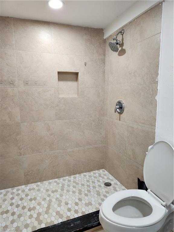 5214 Carlton Street Naples, FL 34113 - Photo 20 of 20 a bathroom with a toilet and a sink