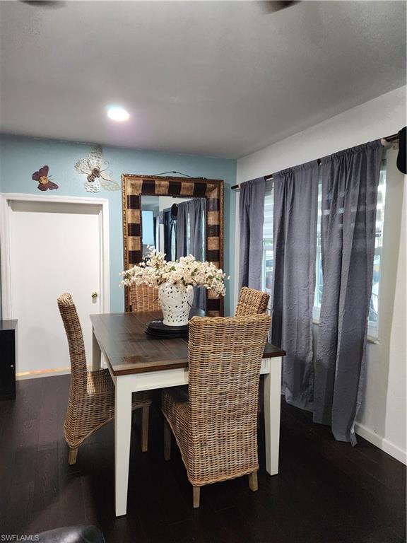 5214 Carlton Street Naples, FL 34113 - Photo 3 of 20 a view of a dining room with furniture and window