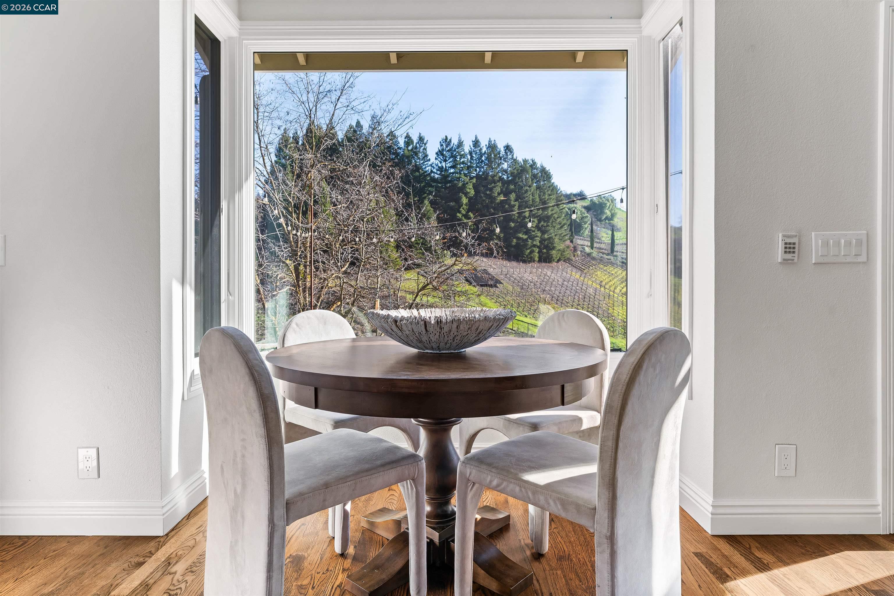 138 Sunhaven Road Danville, CA 94506 - Photo 13 of 60 a view of a dining room with furniture and a potted plant