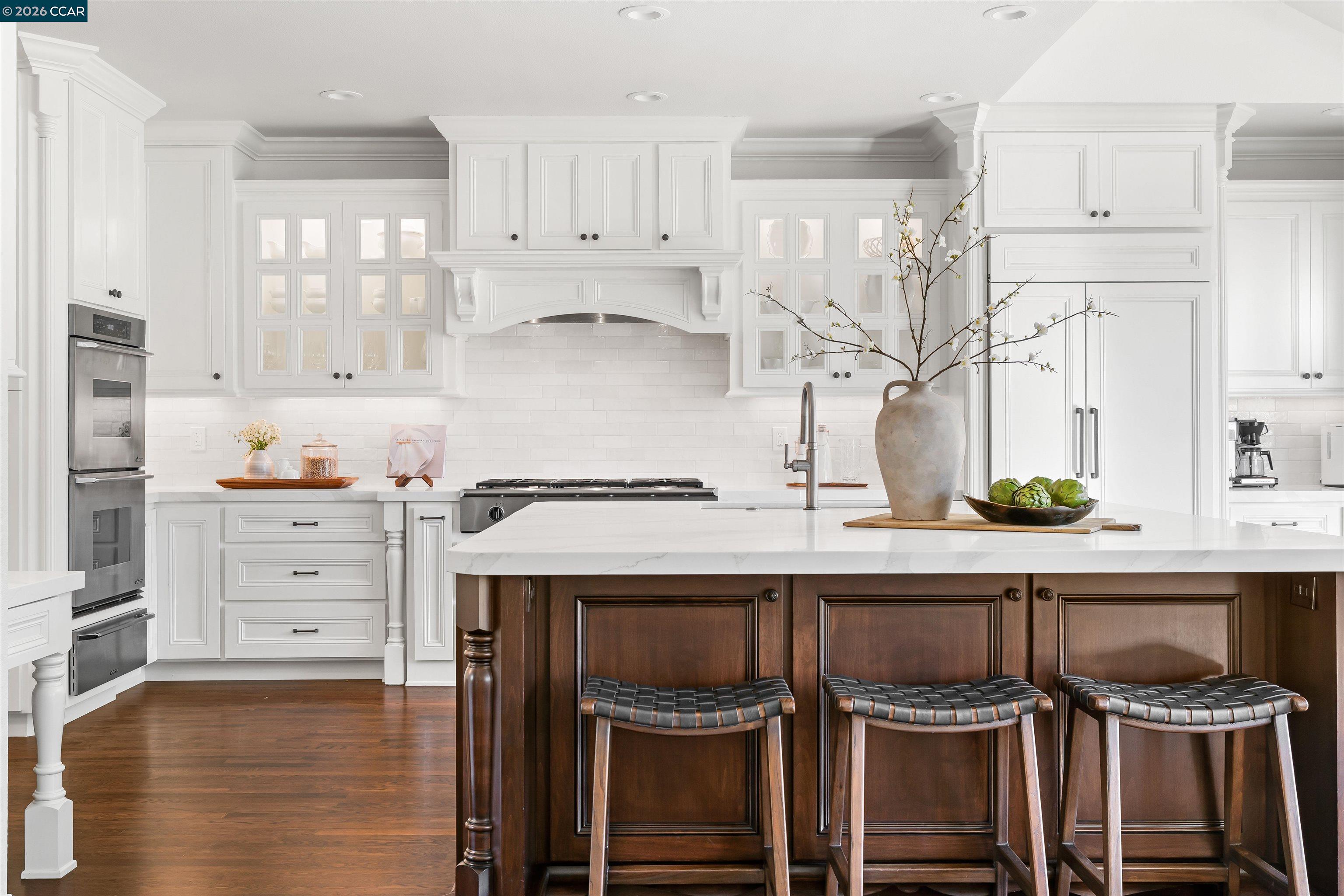138 Sunhaven Road Danville, CA 94506 - Photo 15 of 60 a kitchen with white cabinets and appliances